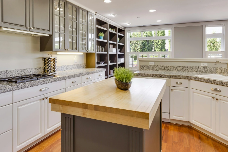 white and gray themed kitchen counters with wood cabinetry