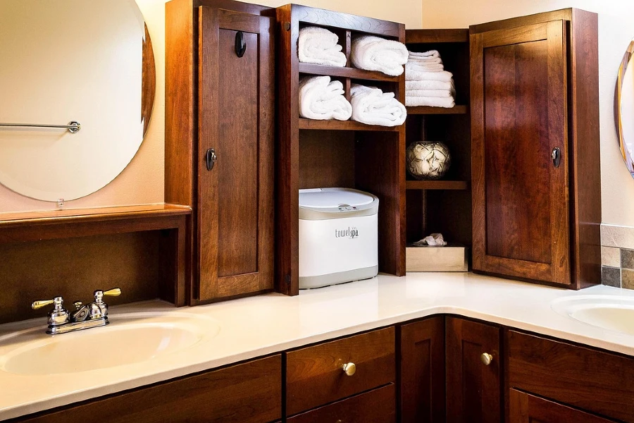 bathroom sinks featuring wood cabinets
